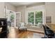 Home office with hardwood floors, chair and window seat with a wooded view at 2713 Misty Rock Cv, Dacula, GA 30019
