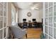 Home office featuring hardwood floors, lots of natural light and built in desk area at 2713 Misty Rock Cv, Dacula, GA 30019