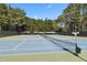 Well-maintained community tennis courts surrounded by lush trees, perfect for recreation at 2713 Misty Rock Cv, Dacula, GA 30019