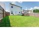 Spacious back yard with a well-maintained lawn and a privacy fence at 1574 Leonard St, Hampton, GA 30228