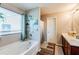 Bathroom showcasing a soaking tub, double sink vanity and decorative wall art at 1574 Leonard St, Hampton, GA 30228