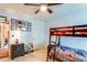Bedroom features bunk beds, ceiling fan, and framed pictures on the wall at 1574 Leonard St, Hampton, GA 30228