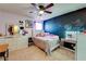 Bedroom with chalkboard wall, dresser with television, and a vanity table at 1574 Leonard St, Hampton, GA 30228