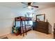 Bedroom equipped with bunk beds, a dresser, and a large mirror at 1574 Leonard St, Hampton, GA 30228