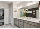 Bathroom with double sink vanity with a large mirror, white countertops and gray cabinets at 1821 Huntington Hills Nw Ln, Atlanta, GA 30309