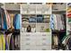Walk-in closet with custom shelving and drawer units to maximize storage at 1821 Huntington Hills Nw Ln, Atlanta, GA 30309