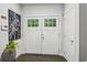 Inviting foyer with stylish double doors and modern artwork at 1821 Huntington Hills Nw Ln, Atlanta, GA 30309