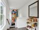 Upstairs landing featuring modern artwork and a stylish bar cart at 1821 Huntington Hills Nw Ln, Atlanta, GA 30309