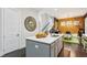 Bright kitchen features a large island, stainless steel sink, and modern gray cabinets at 1821 Huntington Hills Nw Ln, Atlanta, GA 30309
