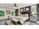 Beautifully appointed main bedroom with dark wall and bench at the foot of the bed at 1821 Huntington Hills Nw Ln, Atlanta, GA 30309