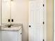 Well-lit bathroom with a single sink vanity, granite countertop, and modern fixtures, providing a clean and functional space at 421 River Trace Dr, Villa Rica, GA 30180