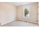 Cozy bedroom with neutral walls, carpet, and a window offering a pleasant view, creating a comfortable retreat at 421 River Trace Dr, Villa Rica, GA 30180