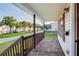 The home has a wood porch with white columns, wood decking, and a railing overlooking the front yard at 421 River Trace Dr, Villa Rica, GA 30180