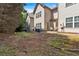 A view of the property backyard with a patio area and trees at 4349 Kousa Rd # 4, Austell, GA 30106