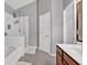 Bright bathroom with a glass enclosed shower and tub with updated double sink vanity at 4349 Kousa Rd # 4, Austell, GA 30106