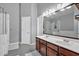 Modern bathroom including a double sink vanity and tiled walk-in shower and tub at 4349 Kousa Rd # 4, Austell, GA 30106