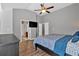 Spacious bedroom showcasing wood floors, a ceiling fan, and neutral wall color at 4349 Kousa Rd # 4, Austell, GA 30106