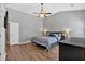 Spacious bedroom offering hardwood floors, a ceiling fan, and neutral wall color at 4349 Kousa Rd # 4, Austell, GA 30106