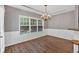 Elegant dining room with hardwood floors, decorative wainscoting, and ample natural light at 4349 Kousa Rd # 4, Austell, GA 30106