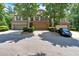 Townhome with a two-car garage, manicured front yard, and inviting curb appeal at 4349 Kousa Rd # 4, Austell, GA 30106