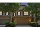 Attractive exterior of the townhome featuring a two-car garage and stone accents at 4349 Kousa Rd # 4, Austell, GA 30106