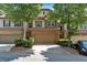Charming townhome showcasing a two-car garage, stone accents, and well-maintained landscaping at 4349 Kousa Rd # 4, Austell, GA 30106