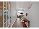 Hallway featuring wood floors, neutral paint, and staircase leading to the upper level at 4349 Kousa Rd # 4, Austell, GA 30106