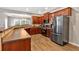 Updated kitchen with stainless steel refrigerator and wooden cabinets, ideal for cooking at 4349 Kousa Rd # 4, Austell, GA 30106