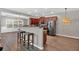 Open-concept kitchen with stainless steel appliances, breakfast bar, and modern design at 4349 Kousa Rd # 4, Austell, GA 30106
