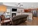 Cozy living room with a fireplace, wood floors, and open floor plan at 4349 Kousa Rd # 4, Austell, GA 30106