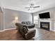 Comfortable living room highlighting a fireplace with wood flooring at 4349 Kousa Rd # 4, Austell, GA 30106