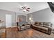 Spacious living room with hardwood floors and comfortable leather sofas, perfect for relaxation at 4349 Kousa Rd # 4, Austell, GA 30106