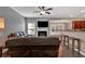 Comfortable living room featuring fireplace, open floor plan, and seamless flow into kitchen at 4349 Kousa Rd # 4, Austell, GA 30106