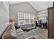 Inviting living room with a large window, wood floors, and comfortable seating at 4349 Kousa Rd # 4, Austell, GA 30106