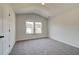 Neutral bedroom with a window and a door at 443 Lothbury Ave, Locust Grove, GA 30248