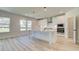 Modern kitchen with an island, sleek appliances, and bright lighting at 443 Lothbury Ave, Locust Grove, GA 30248