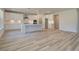 Bright open kitchen with center island, white cabinets and modern appliances at 443 Lothbury Ave, Locust Grove, GA 30248
