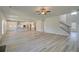 Open living space with hardwood floors and a kitchen at 443 Lothbury Ave, Locust Grove, GA 30248