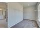 Spacious walk-in closet with lots of shelf space and carpet at 443 Lothbury Ave, Locust Grove, GA 30248