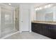Bathroom featuring a glass shower, granite vanity, and modern fixtures at 6761 Cedar Glen Rd, Peachtree Corners, GA 30360