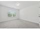 Bright bedroom with neutral carpet, natural light, and crisp, white walls at 6761 Cedar Glen Rd, Peachtree Corners, GA 30360