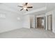 Bright bedroom with two windows, tray ceiling, and a spacious closet at 6761 Cedar Glen Rd, Peachtree Corners, GA 30360