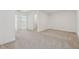 Spacious bedroom with neutral carpet and bright white walls at 6761 Cedar Glen Rd, Peachtree Corners, GA 30360