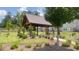 Community picnic pavilion with seating surrounded by lush landscaping at 6761 Cedar Glen Rd, Peachtree Corners, GA 30360