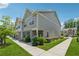 Charming townhouse with well-maintained lawn and sidewalk in a residential neighborhood at 6761 Cedar Glen Rd, Peachtree Corners, GA 30360