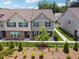 Attractive townhouse with landscaping, fenced yard, and brick and siding facade at 6761 Cedar Glen Rd, Peachtree Corners, GA 30360