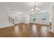 Well-lit living room featuring hardwood floors, fireplace, and ceiling fan at 6761 Cedar Glen Rd, Peachtree Corners, GA 30360