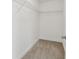 Walk-in closet with carpet and white wire shelving at 6761 Cedar Glen Rd, Peachtree Corners, GA 30360