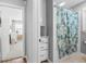 Bathroom and connecting Bedroom with a blue patterned shower curtain at 1959 Audubon Ne Dr, Atlanta, GA 30329