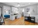 Brightly lit room featuring hardwood floors, white trim, and a stylish desk with white cabinets at 1959 Audubon Ne Dr, Atlanta, GA 30329